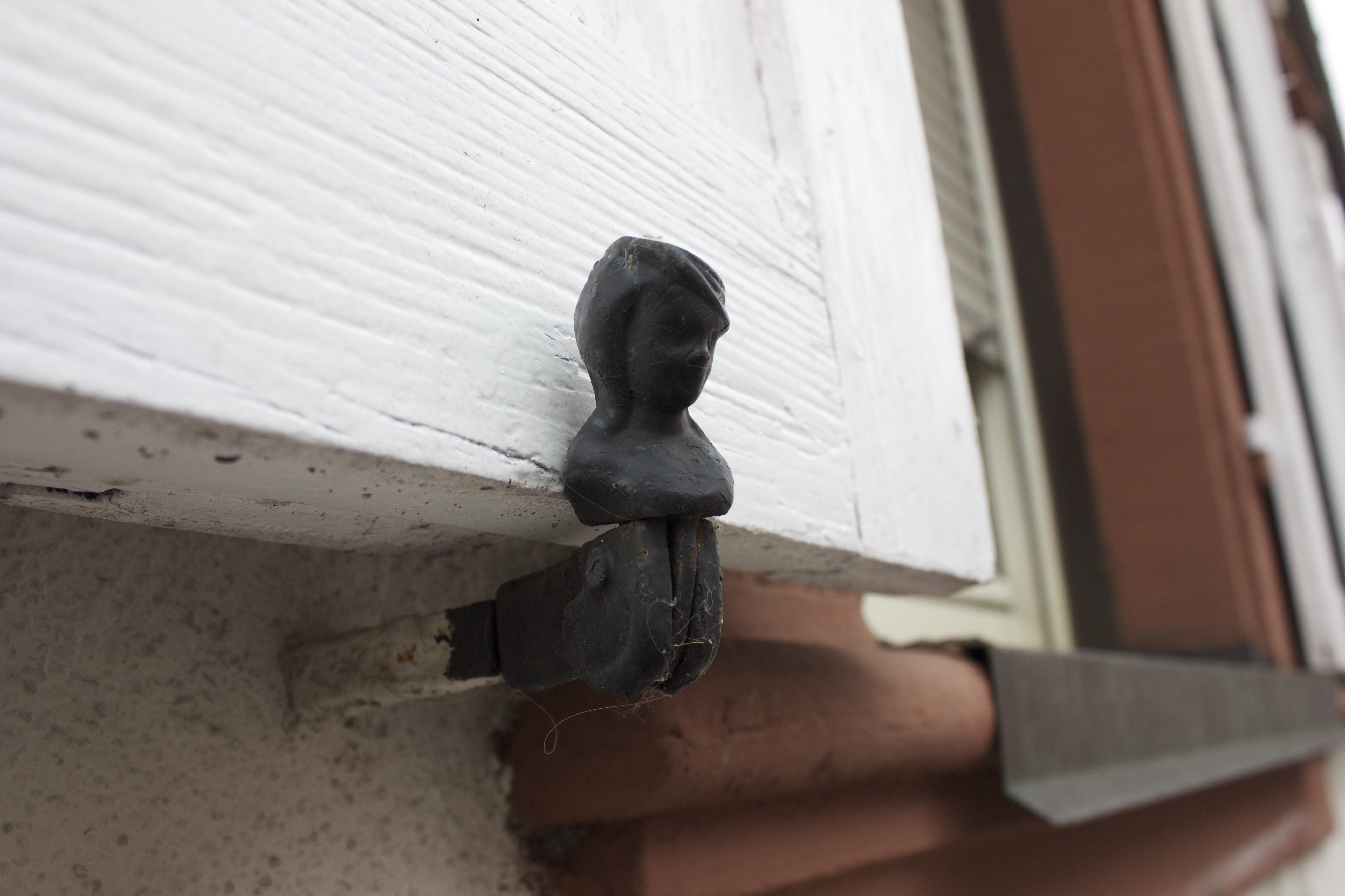 This little lady is used to prop open the shutters. Isn't she adorable?